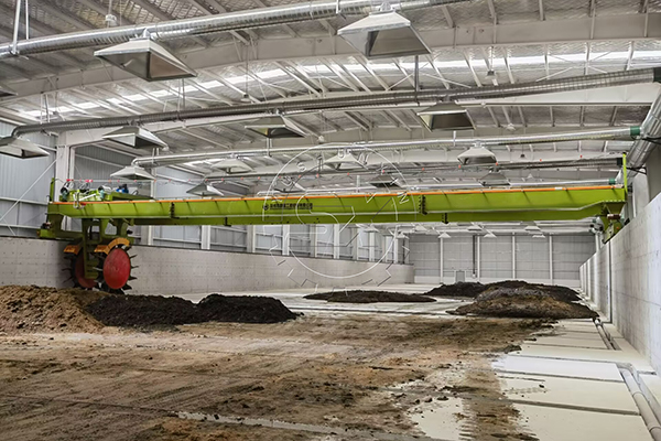 Wheel compost turner for large scale goat manure disposal